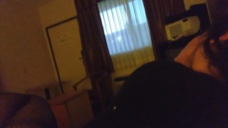 Having fun in motel with window open