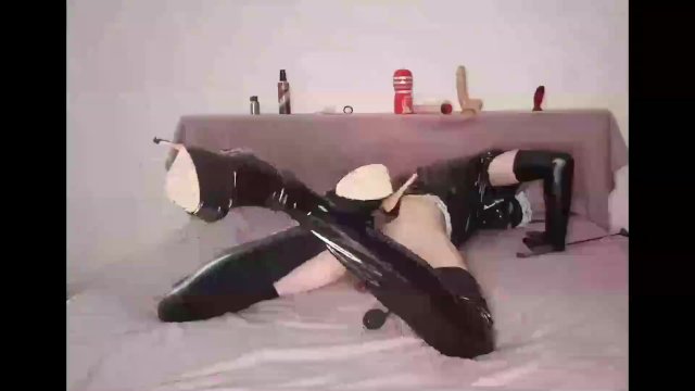 maid in latex, having a little fun on the bed