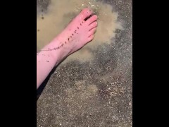 Cleaning my muddy feet with hose
