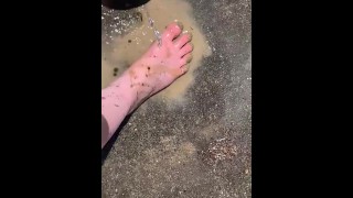 Cleaning my muddy feet with hose