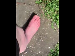 Feet playing in a puddle