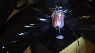 Estim cum milking with chastity device