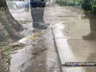 Hot booted guy in the rain. He strips to reveal shiny latex. Lots of Boot worship & jerking off