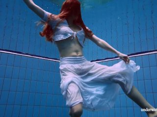 Redhead Marketa in aWhite Dress in the Pool