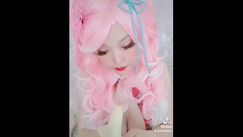 Animegirl peeling Banana Cosplay Pinkhair