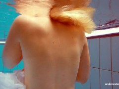 Hot babe Melisa Darkova dressed underwater