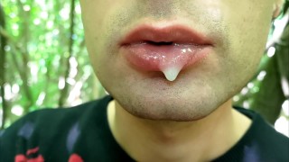 Close-Up Of A Man Playing With Cum On His Lips Blowing Cum Bubbles And Swallowing It All