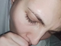 POV Amazing teen gives a blowjob in the car while it's raining outside to cheer him up and swallows