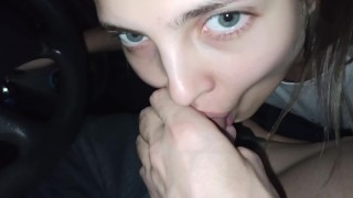 POV Amazing teen gives a blowjob in the car while it's raining outside to cheer him up and swallows