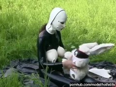 Rubber Girl Full in Black Latex Catsuit and Mask Plays with herself Outdoor in a Meadow - Part 3