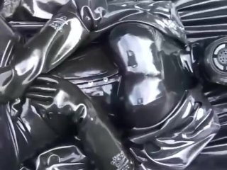 Latex Girl Full in Black Rubber and Gasmask Chill Outs OutdoorIn Garden in a HeavyRubber Hammock