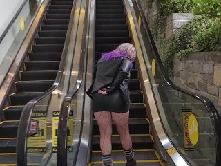 MILF in Mini Skirt Rubs Pussy on Public Escalator