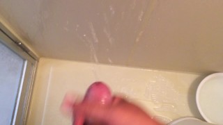Japanese boy squirting handjob while panting in the bathroom.