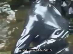 Outdoor walk in the wood and river bath full encased in black latex catsuit and rubber gas mask