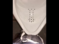 Video Wearing a Female to Male (FTM) Stand to Pee (STP) device, whipping it out to pee at a urinal 