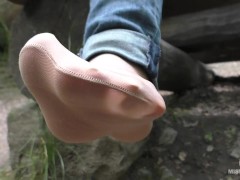 Jeans Feet In Nylon Socks In The Forest