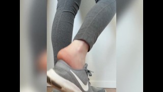 Taking off and playing with my sneakers with my sweaty, warm, bare feet