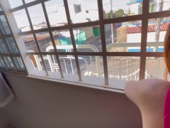 Fucking the slut at the window and fucking her mouth for all to see.