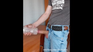 Fit Russian guy in jeans fucks an artificial vagina and cums on the table