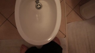 A Small-Chested Man Pisses In The Bidet