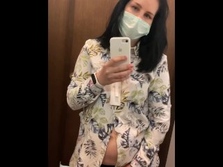 Pregnant beauty masturbates in a clothing store and tries on dresses