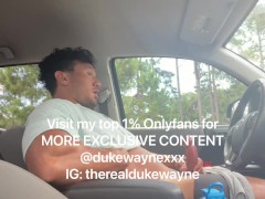 Cumming in a parking lot