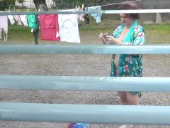 Neighbor in bathrobe without panties and bra dries washing courtyard, neighbour watching out window