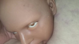 Doll giving head.