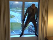 Preview 1 of silicone masked wetsuited guy gets horny at hotel window and humps his pillows