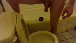 Pissing In The Toilet While Standing On The Bathtub