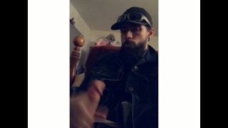 Bearded biker jacks off moans and cums