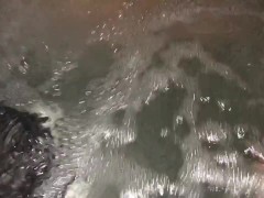 Sneak peak of my wife’s tits in our backyard hot tub tonight