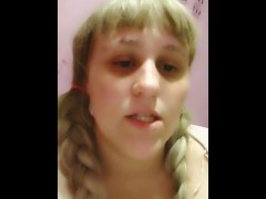 Smoking a cigarette in pink with braids 