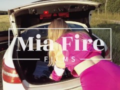 Video Fitness girl Mia Fire fucked in the field by the car
