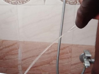 Rajesh Pissing in the Bathroom