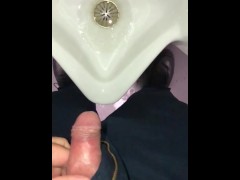 Pulling back foreskin in slow motion just before taking a piss