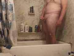 Fat ass jerks in shower and swallows cum