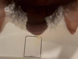 Chubby Japanese guy pees in the bathroom drain