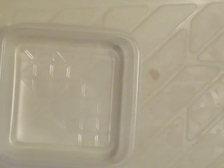 Pissing into the plastic case.