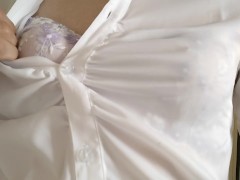 (Crossdresser) light purple bra is seen through the blouse.