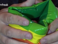 Down Jacket Wearing Fetish Guy Pleasures Himself With Inflatable Water Wing on Bed of Air Mattresses