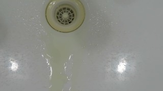 pissing in wash basin.