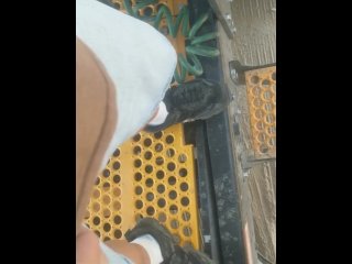 Peeing by a trailer at work