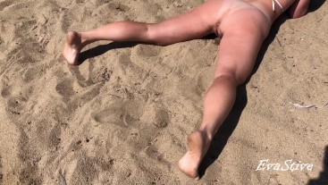 Peeing while lying on the beach