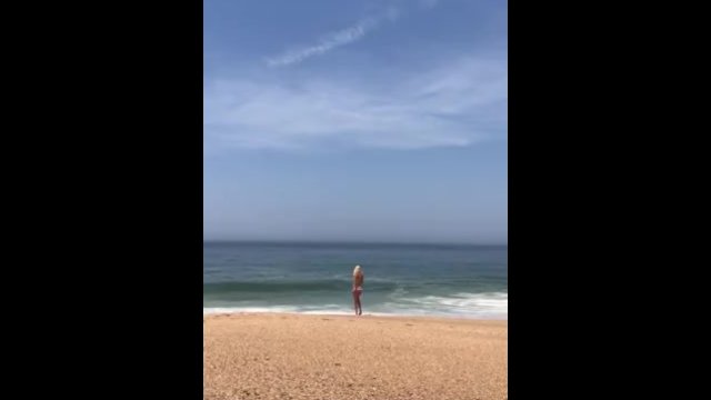 Naked tits near the ocean