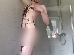 Pouring chocolate sauce on myself and tasting some