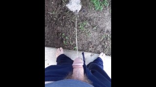 Fast pissing in the backyard with neighbor gardening next door