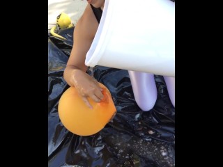 Shiny leotard balloonclimb-in using gallons of_slime