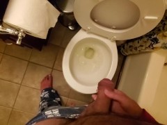 Gently holding my boyfriend's dick while he pees in the toilet