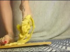 Crushing a banana between toes